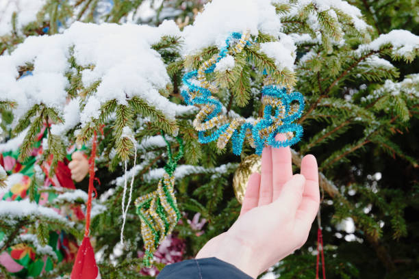 istock Christmas tree toy on a snowy branch 1363347950