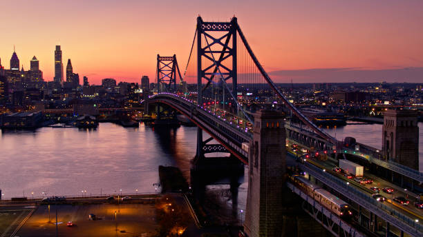 istock Traffic and Train on Ben Franklin Bridge at Dusk - Aerial 1363348022