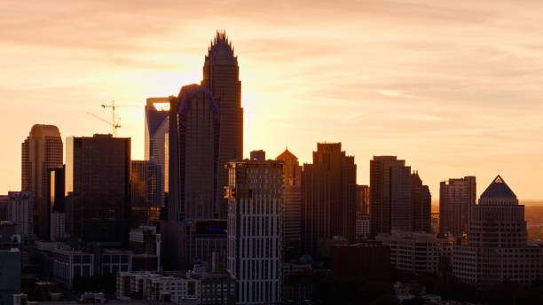 istock Sun Setting Behind Skyscrapers in Charlotte, NC 1363351821