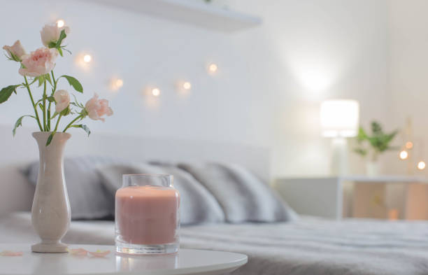 istock pink roses in vase on table in bedroom 1363352548
