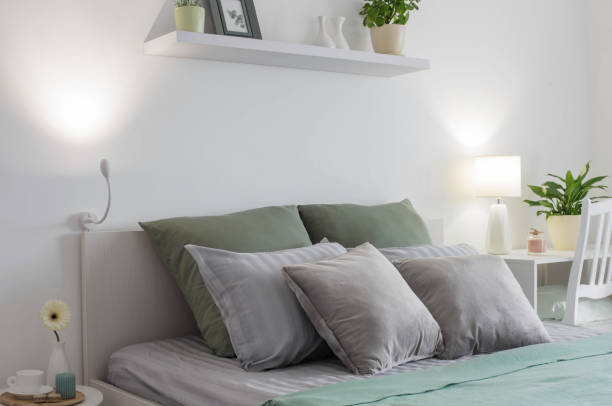 istock white bedroom with gray and green linens 1363352550