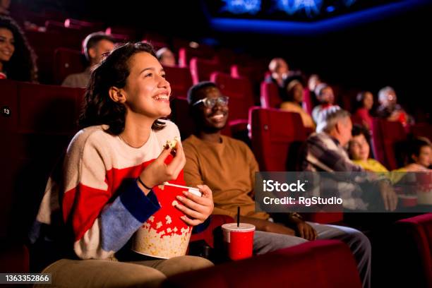 Friends Enjoying A Comedy Movie At The Cinema Stock Photo - Download Image Now - Movie Theater, Movie, Film Industry
