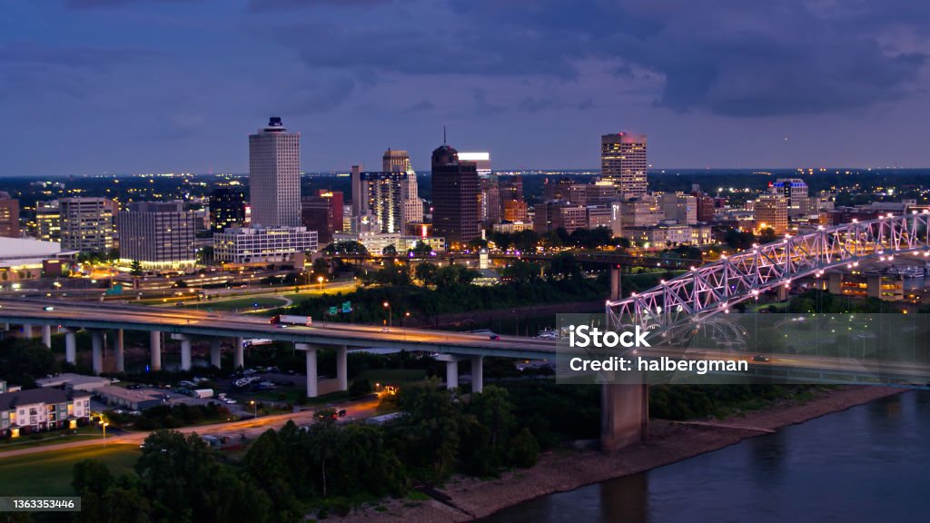Memphis Waterfront and Downtown Skyline on Stormy Evening - Drone Shot Aerial shot of Memphis, Tennessee on a stormy evening, looking across the illuminated Hernando de Soto Bridge towards the downtown skyline. Memphis - Tennessee Stock Photo