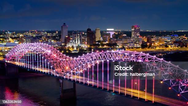 Pink And Purple Lights Shimmering On Hernando De Soto Bridge Over Mississippi River Stock Photo - Download Image Now