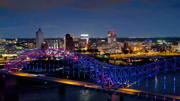 Light Show on the Hernando de Soto Bridge at Night with Downtown Memphis Beyond Aerial shot of the spectacular light show on the Hernando de Soto Bridge, which carries Interstate 40 across the Mississippi between Tennessee and Arkansas, with downtown Memphis in the background. memphis tennessee stock pictures, royalty-free photos & images
