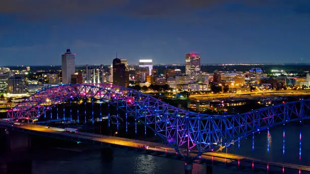 Aerial shot of the spectacular light show on the Hernando de Soto Bridge, which carries Interstate 40 across the Mississippi between Tennessee and Arkansas, with downtown Memphis in the background.