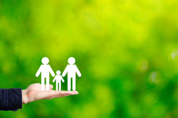 istock Green background with family of three 1363353901