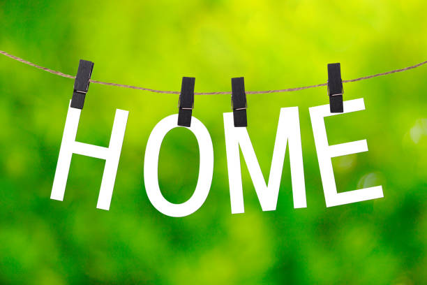 istock HOME letters and green blur background 1363356483