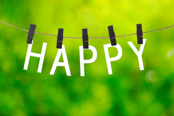 HAPPY letters and green blur background