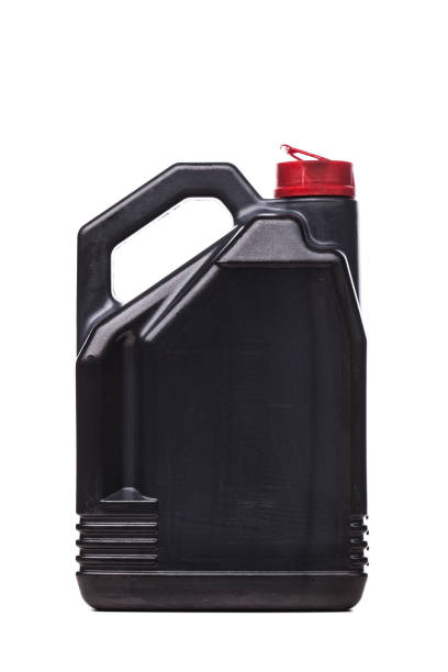 istock Plastic black canister for car engine motor oil with red cap. Isolated on white background.. 1363359337