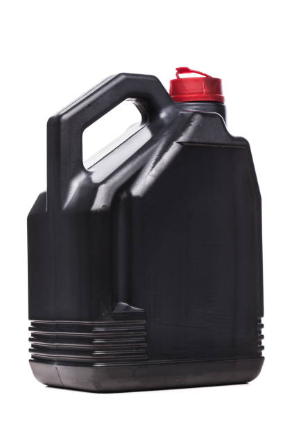 istock Plastic black canister for car engine motor oil with red cap. Isolated on white background.. 1363359342