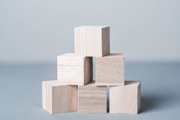 istock Gray background with stacked wooden blocks 1363359618