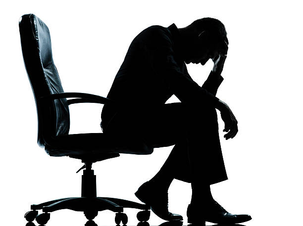 istock one business man  tired sad despair  silhouette 136336019