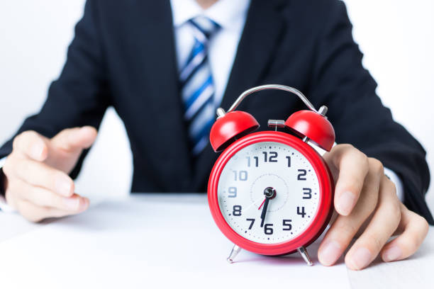 istock Businessman with red alarm clock 1363362118