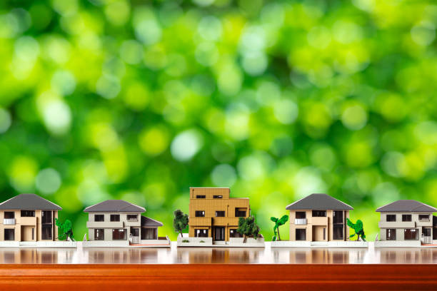 istock House model and green blur background 1363364379