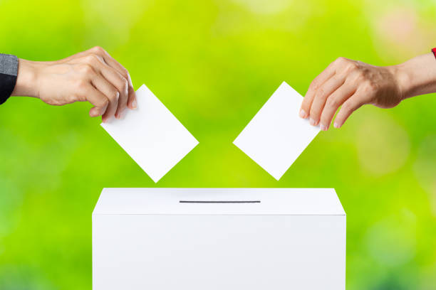 Vote and people hand and green blur background