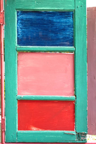istock Old wood window with colorful paint on background 1363367434