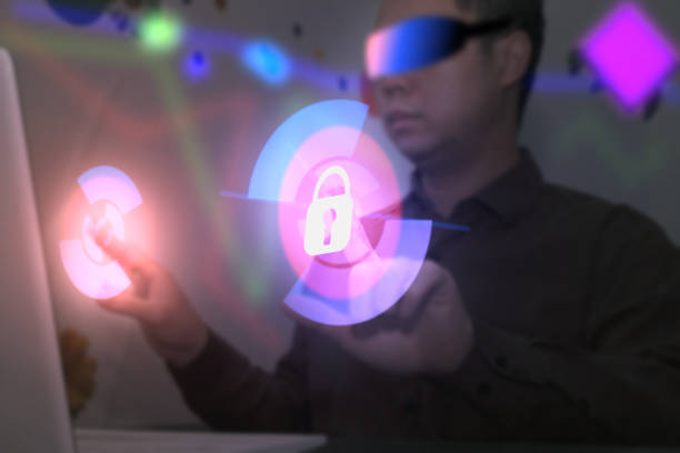 istock Man us VR goggles for online connect metaverse at home for work in futuristic screen security hack protection concept 1363369300