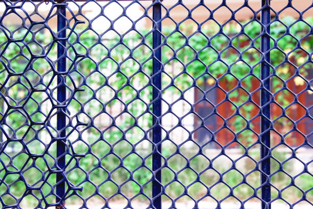 istock Steel fence home patterns on blurred neighbor background 1363370028