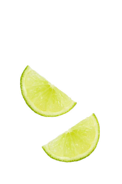 istock Two slices of lemon on a white background with copy space. 1363370034