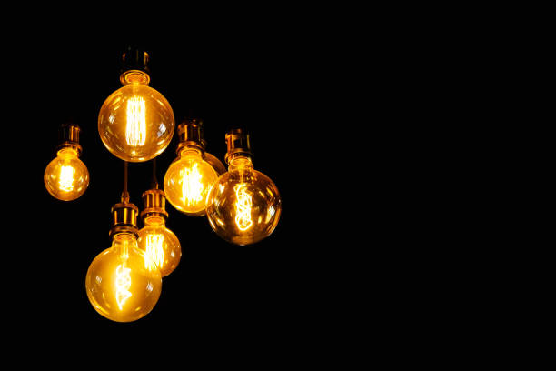 istock Tungsten lamp with black background for copy space. Old fashioned chandelier 1363372532