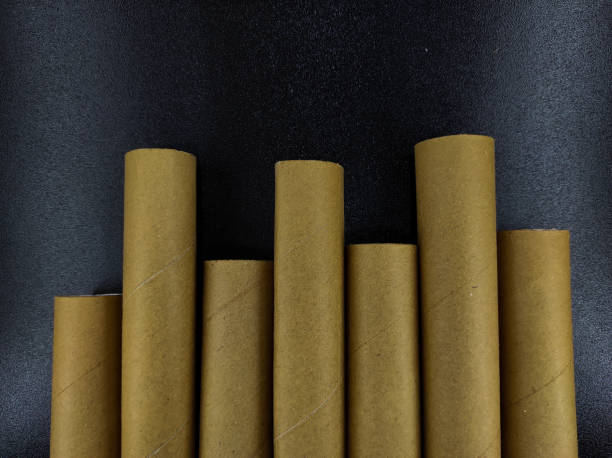 istock Brown cardboard rolls in row - stock photo 1363372698