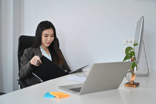 istock Asian woman entrepreneur working at modern workplace. 1363382417