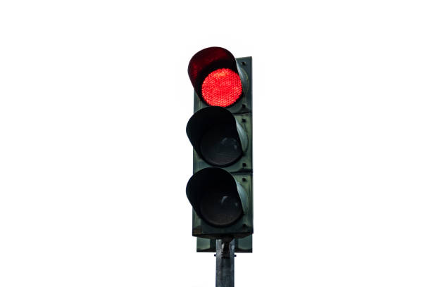 Red traffic light at an intersection and road sign with a green arrow, specifically indicating a right turn for bicycles