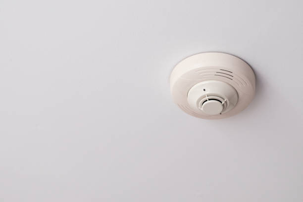 istock Smoke detectors are mounted on a white ceiling. 1363388045