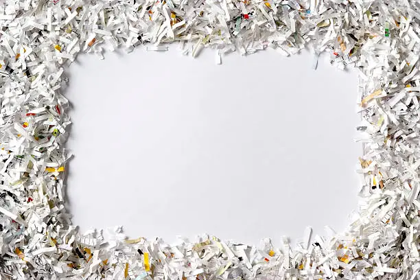 Photo of Frame of the shredded paper on white background