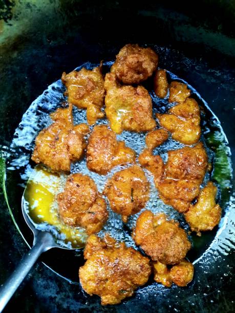 istock Frying Fish Cakes in cooking pan -food preparation. 1363396475