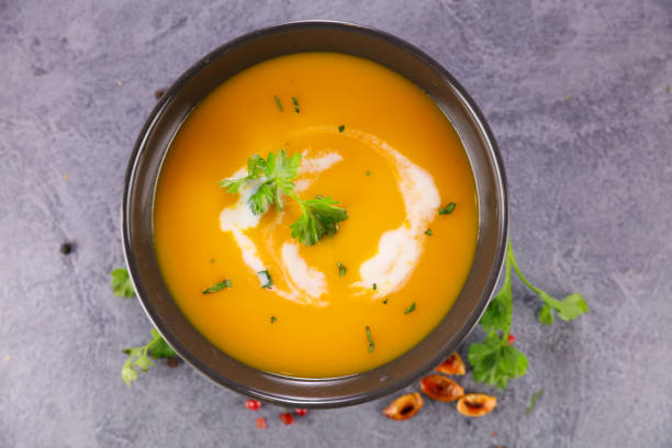 bowl of soup and cream bowl of soup and cream vegetable soup stock pictures, royalty-free photos & images