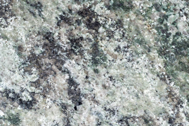 A heterogeneous texture of granite slab. Granitic rock. The coarse-grained plutonic rock structure A heterogeneous texture of granite slab. Granitic rock. The coarse-grained plutonic rock structure feldspar stock pictures, royalty-free photos & images