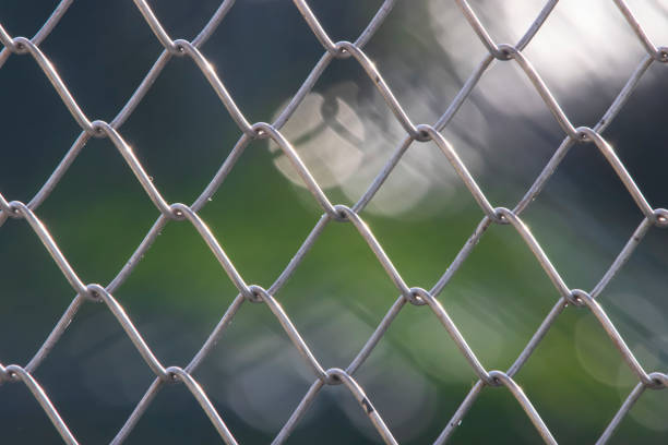 istock Design with chain link fence steel wire mesh on blurry background 1363405200