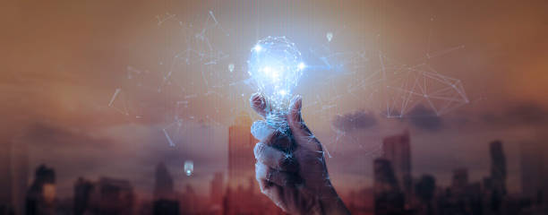 istock Hand businessman holding light bulb with mesh light line.future technology,Alternative energy,idea,saving electricity innovation and inspiration concepts. 1363406031