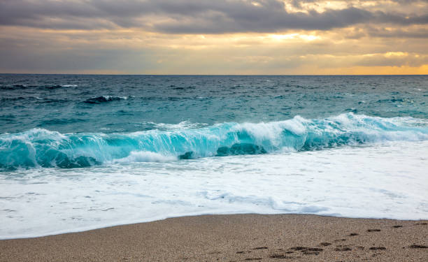 istock turquoise sea and wave at sunset 1363407827