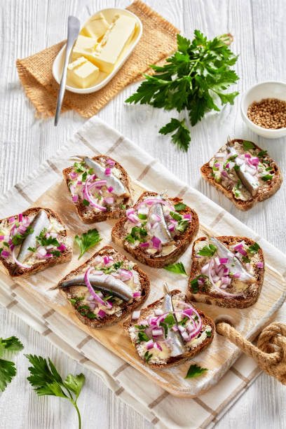 istock pickled sprat rye bread open sandwiches, top view 1363408787