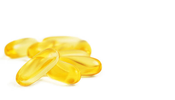 istock Heap of Omega 3 capsules isolated on white background. Copy space 1363408991