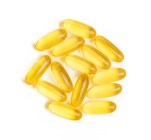 istock Heap of Omega 3 capsules on white background. 1363409015