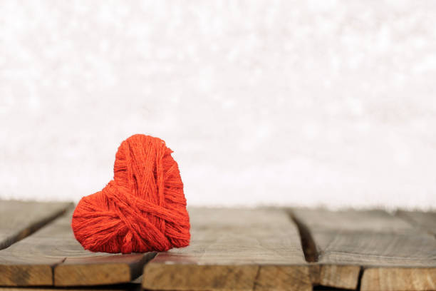 istock red heart on wooden board, bokeh light background. 1363410536