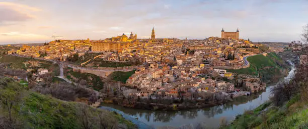 Photo of Panoramic view of the medieval city of Toledo in Castilla La Mancha from the mountain, Spain. View from the Ermita del Valle. Alzacar and Santa Iglesia Primada.