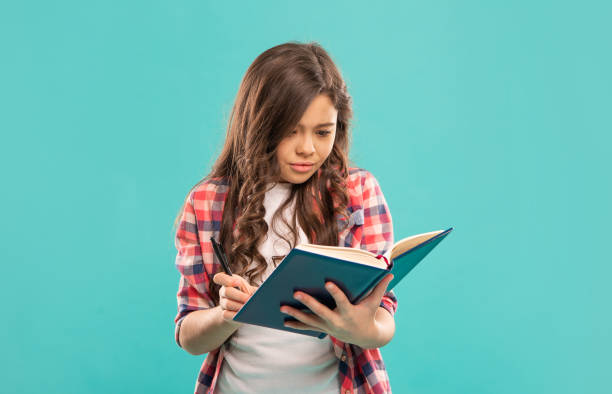 istock Young Girl with Book 1363416991