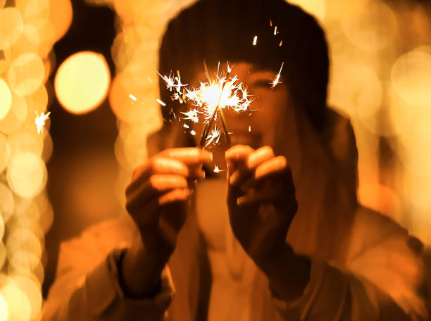 istock Young woman with sparklers 1363418229