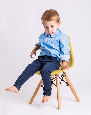 Photoshoot of a two year old boy in the studio with confetti