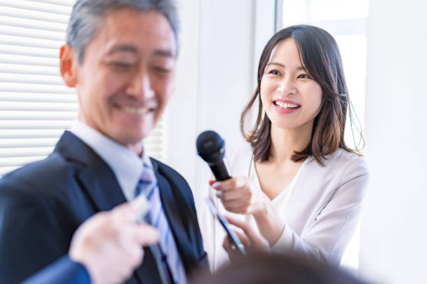 istock Female announcer doing an interview 1363419208