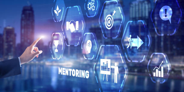 istock Businessman pressing inscription Mentoring. Training Personal development education coaching concept 1363423557