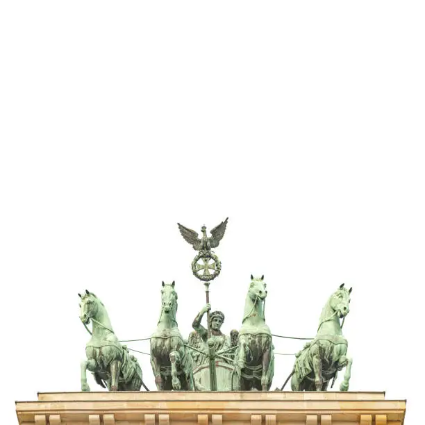 Photo of Quadriga, four horses lead by Viktoria, Roman goddess of victory at Brandenburg Gate (Brandenburger Tor) in Berlin historical downtown, Germany, isolated at white background.