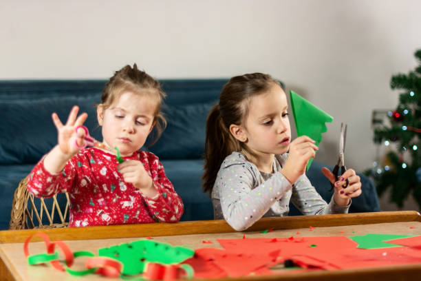 istock Children making Christmas decoration at home 1363424910
