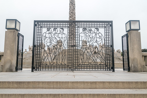 Oslo, Norway - September 24, 2021: The wrought iron gate at the Monolith Plateau at Vigeland Park.