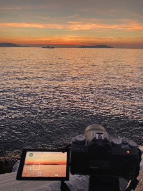 istock close up shot of camera while shooting sunset 1363431732